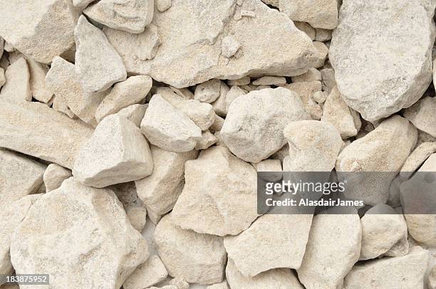 limestone in background with rocks - kalksteen stockfoto's en -beelden