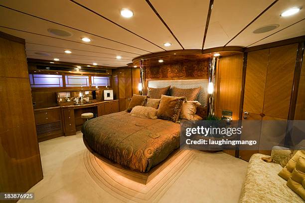 bedroom interior luxury motor yacht wealth - voertuiginterieur stockfoto's en -beelden