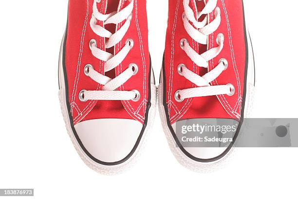 red sneakers - red shoe stock pictures, royalty-free photos & images
