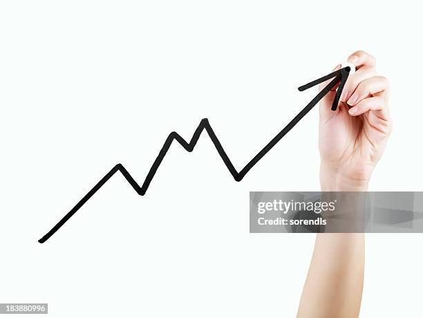 growth chart - holding pen in hand stock pictures, royalty-free photos & images