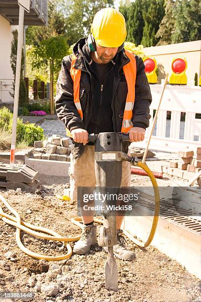 jack and jackhammer - jackhammer stock pictures, royalty-free photos & images