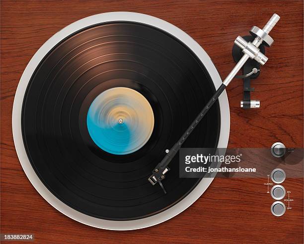 old turntable playing record - deck stockfoto's en -beelden