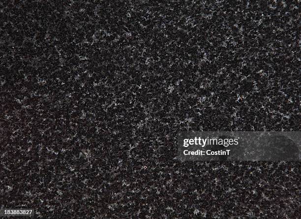 an up close view of black and grey speckled granite  - countertop texture stock pictures, royalty-free photos & images