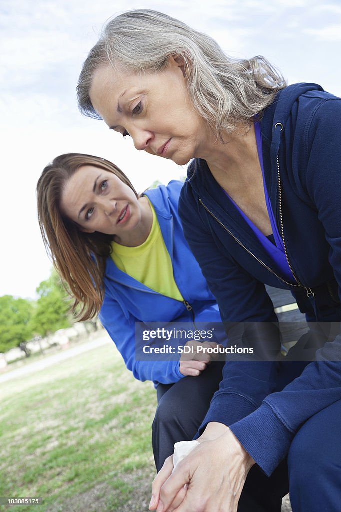 Senior Adult Woman Receiving Encouragement From Supportive Friend