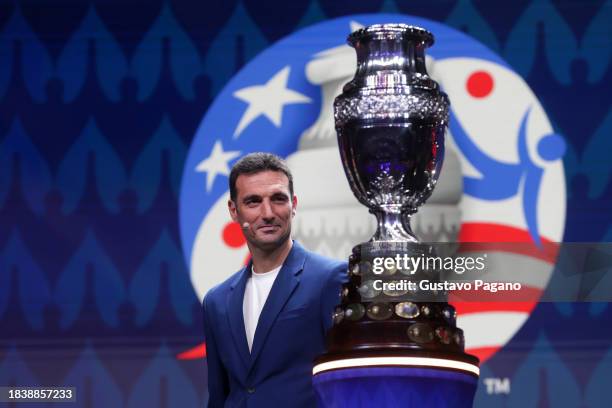 Lionel Scaloni, Head Coach of Argentina, presents the Copa America trophy during the official draw of CONMEBOL Copa America 2024 at James L. Knight...