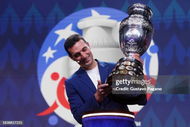 Lionel Scaloni, Head Coach of Argentina, presents the Copa America trophy during the official draw of CONMEBOL Copa America 2024 at James L. Knight...