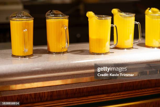 pitchers of mango lassi - mango smoothie stock pictures, royalty-free photos & images