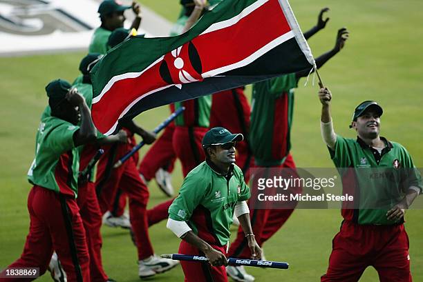 Ravindu Shah and Hitesh Modi of Kenya lead the lap of honour celebrations during the ICC Cricket World Cup Pool B match between Kenya and Bangladesh...