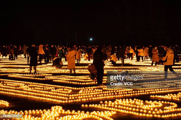Butter lamp are lit on the square in front of the Puning Temple, also known as the Big Buddha Temple, at night to celebrate Butter Lamp Festival on...