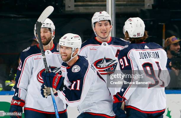 Adam Fantilli of the Columbus Blue Jackets celebrates his goal against the New York Islanders at 10:08 of the second period at UBS Arena on December...