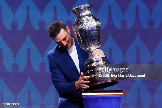 Lionel Scaloni, Head Coach of Argentina, presents the Copa America trophy during the official draw of CONMEBOL Copa America 2024 at James L. Knight...