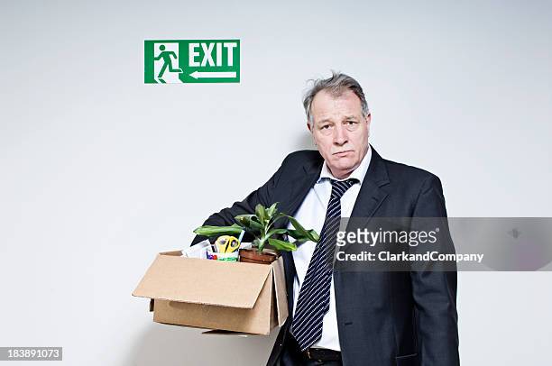 mature white collar male just been fired - carrying boxes stock pictures, royalty-free photos & images