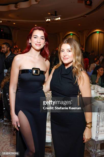 Dua Lipa and Sara Riff attend The Hollywood Reporter's Women in Entertainment 2023 at The Beverly Hills Hotel on December 07, 2023 in Los Angeles,...
