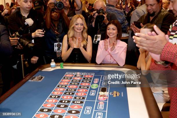 Heather Graham and Sarah Hyland play roulette at the star-studded launch party for official debut of craps, roulette and sports betting in the state...