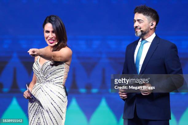 Presenters Lindsay Casinelli and Juan Jose Buscaliaer speak during the official draw of CONMEBOL Copa America 2024 at James L. Knight Center on...