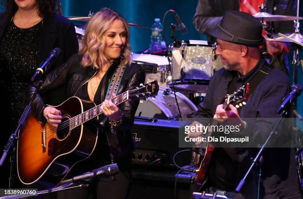 Sheryl Crow and Mark Barden perform onstage during the Artist For Action Concert Benefit for Sandy Hook Promise at NYU Skirball Center on December...