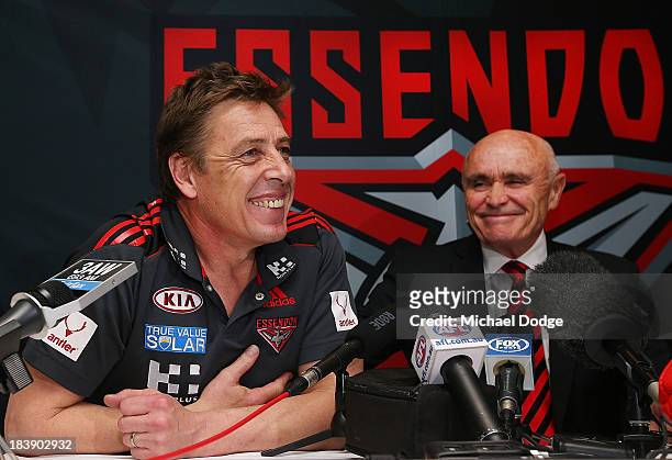 New Bombers coach Mark Thompson reacts next to Chairman Paul Little during an Essendon Bombers AFL press conference at Windy Hill on October 10, 2013...