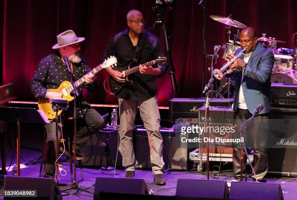 Jimmy Vivino, Bernie Williams and Fernando Pullum perform onstage during the Artist For Action Concert Benefit for Sandy Hook Promise at NYU Skirball...