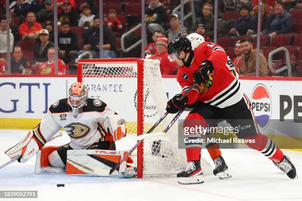 Lukas Dostal of the Anaheim Ducks makes a save against Joey Anderson of the Chicago Blackhawks during the second period at the United Center on...