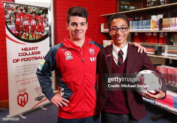 Heart footballer Jeremy Walker poses with student Cameron Quashi of John Faulkner College for the launch of the Heart College Of Football program...