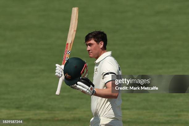 Matthew Renshaw of the Prime Ministers XI celebrates and acknowledges the crowd after scoring a century during day three of the Tour Match between...