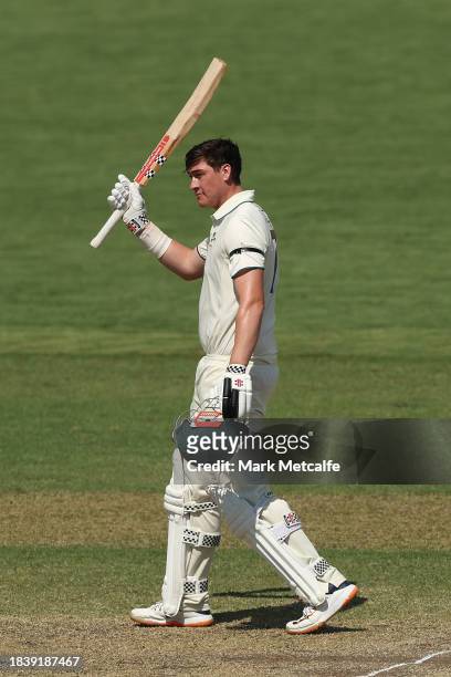 Matthew Renshaw of the Prime Ministers XI celebrates and acknowledges the crowd after scoring a century during day three of the Tour Match between...
