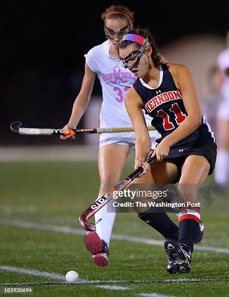 Westfield's Emily McNamara, left, watches Herndon's Katherine Wilson, right, arrive at the ball as Westfield defeats Herndon 7 - 1 in girls hockey at...