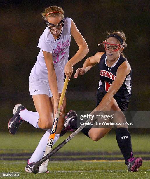 Westfield's Emily McNamara, left, competes for the ball with Herndon's Taylor Stone, right, as Westfield defeats Herndon 7 - 1 in girls hockey at...