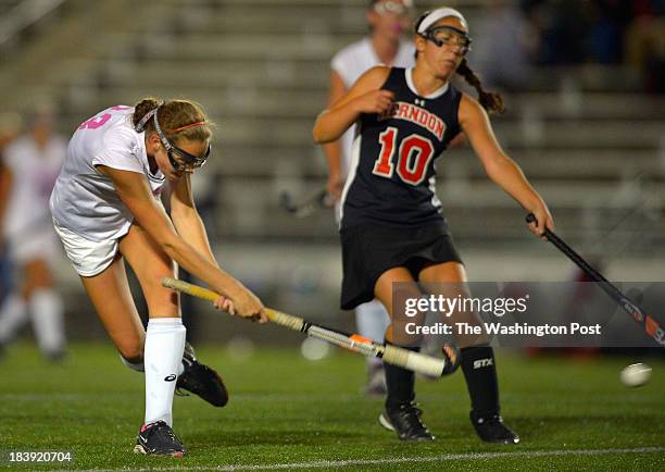 Westfield's Emily McNamara, left, shoots her 2nd goal in the 1st half past Herndon's Rachel Delmontagne during Westfield's defeat of Herndon 7 - 1 in...