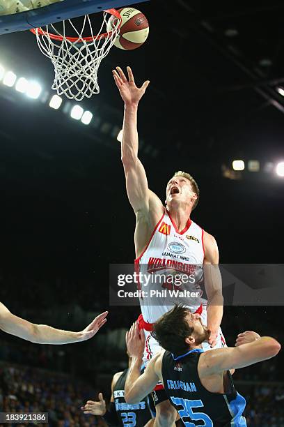 David Gruber of the Hawks is blocked by Jeremiah Trueman of the Breakers during the round one NBL match between the New Zealand Breakers and the...