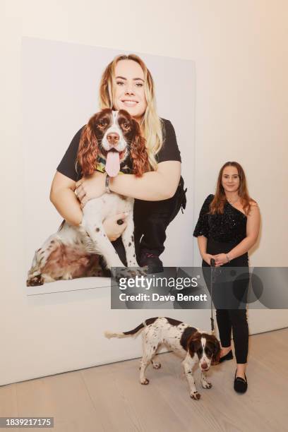 Emma & Albie attends the exhibition opening preview of "Dogs with Jobs" by Rankin hosted by George, The Caring Family Foundation and The Kennel Club...