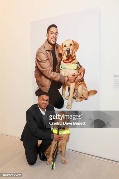 Devante & Mack attends the exhibition opening preview of "Dogs with Jobs" by Rankin hosted by George, The Caring Family Foundation and The Kennel...