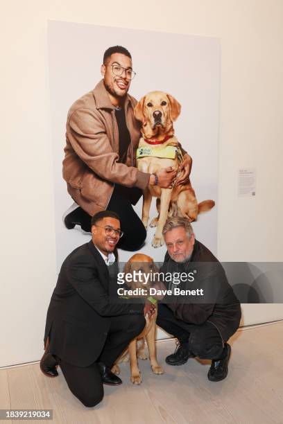 Devante & Mack and Rankin attend the exhibition opening preview of "Dogs with Jobs" by Rankin hosted by George, The Caring Family Foundation and The...