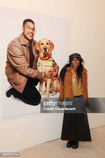 Sinitta attends the exhibition opening preview of "Dogs with Jobs" by Rankin hosted by George, The Caring Family Foundation and The Kennel Club...