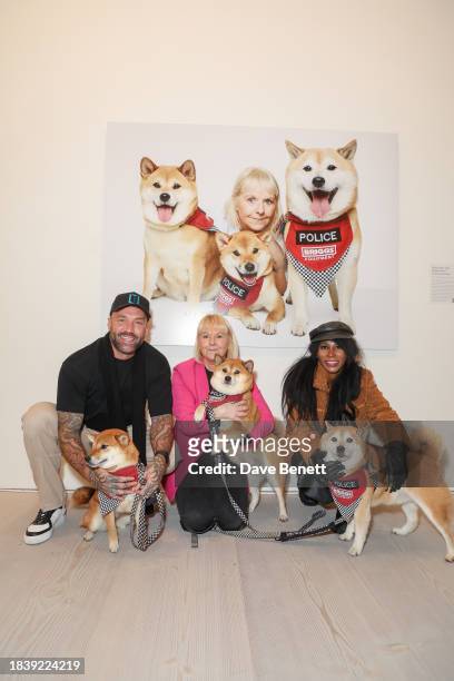 Calum Best, Karen with Dennis, Riot & Rosie and Sinitta attend the exhibition opening preview of "Dogs with Jobs" by Rankin hosted by George, The...