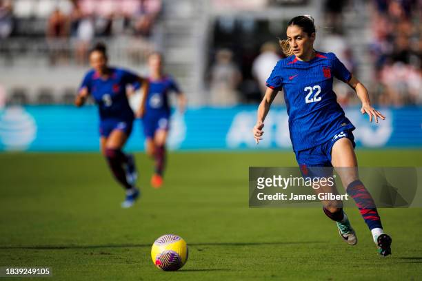 Savannah DeMelo of the United States dribbles the ball during the first half of a match against China PR at DRV PNK Stadium on December 02, 2023 in...