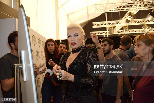 The singer Ajda Pekkan is seen backstage at the Raisa-Vanessa Sason show during Mercedes-Benz Fashion Week Istanbul s/s 2014 Presented By American...