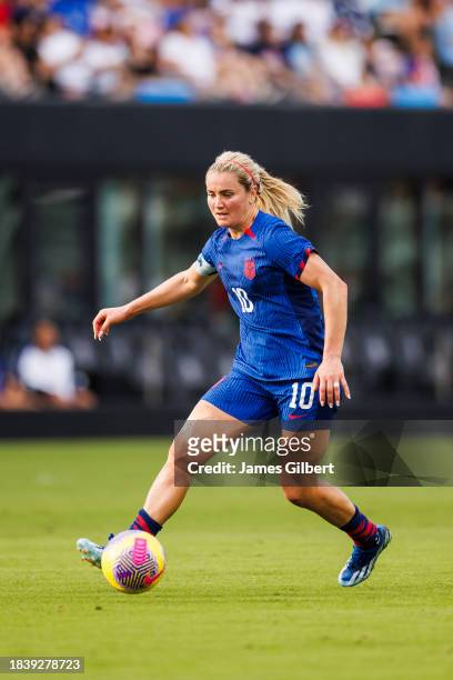 Lindsey Horan of the United States dribbles the ball during the first half of a match against China PR at DRV PNK Stadium on December 02, 2023 in...