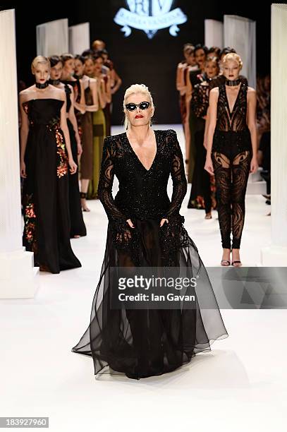 Actress Ajda Pekkan walks the runway at the Raisa-Vanessa Sason show during Mercedes-Benz Fashion Week Istanbul s/s 2014 Presented By American...