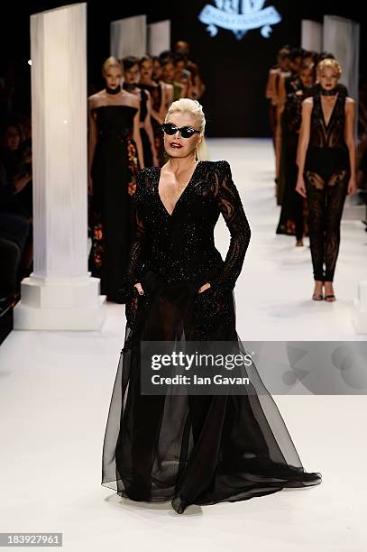 Actress Ajda Pekkan walks the runway at the Raisa-Vanessa Sason show during Mercedes-Benz Fashion Week Istanbul s/s 2014 Presented By American...