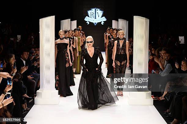 Actress Ajda Pekkan walks the runway at the Raisa-Vanessa Sason show during Mercedes-Benz Fashion Week Istanbul s/s 2014 Presented By American...