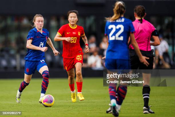 Emily Sonnett of the United States dribbles the ball during the first half of a match against China PR at DRV PNK Stadium on December 02, 2023 in...
