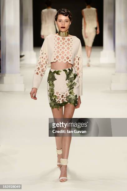 Model walks the runway at the Raisa-Vanessa Sason show during Mercedes-Benz Fashion Week Istanbul s/s 2014 Presented By American Express on October...