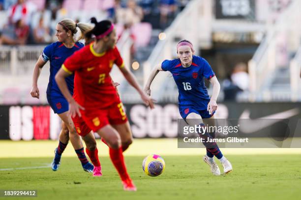 Rose Lavelle of the United States dribbles the ball during the second half of a match against China PR at DRV PNK Stadium on December 02, 2023 in...
