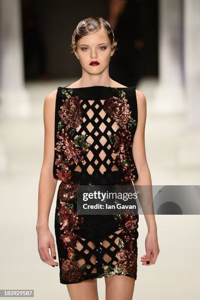 Model walks the runway at the Raisa-Vanessa Sason show during Mercedes-Benz Fashion Week Istanbul s/s 2014 Presented By American Express on October...