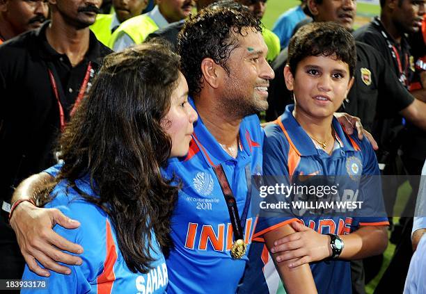 Indian player Sachin Tendulkar walks with his children Arjun and daughter Sara after India defeated Sri Lanka in the ICC Cricket World Cup 2011 final...