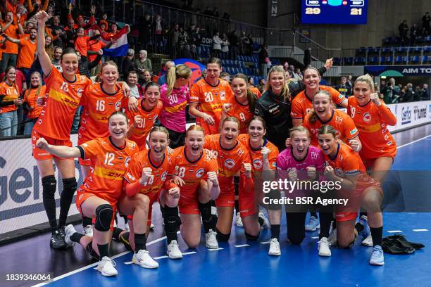 Players of The Netherlands celebrate the win and pose for a teamphoto during the 26th IHF Women's World Championship Handball Preliminary Round Group...