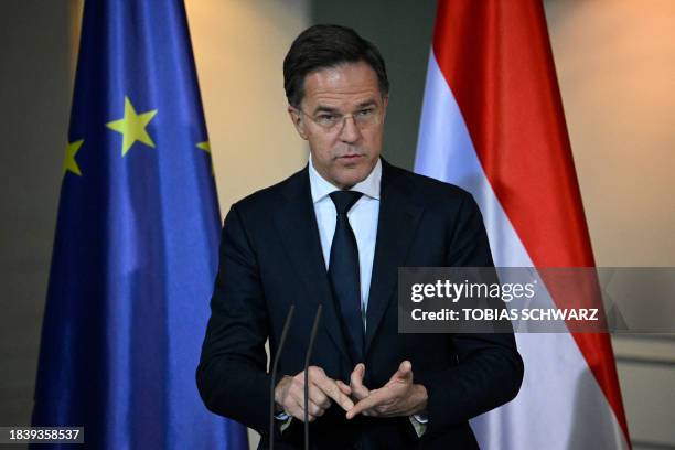 Dutch Prime Minister Mark Rutte gestures as he delivers a joint press conference with German Chancellor following talks at the Chancellery in Berlin...