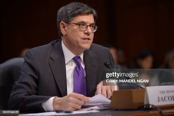 Treasury Secretary Jacob Lew testifies before the US Senate Finance Committee about the debt limit on October 10 on Capitol Hill in Washington, DC. A...