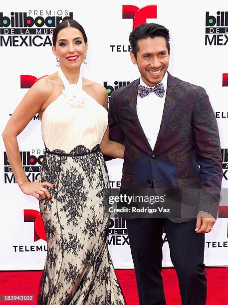 Presenter Monica Noguera and TV personality Christian Ramirez attend the 2013 Billboard Mexican Music Awards arrivals at Dolby Theatre on October 9,...